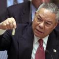 then U.S. Secretary of State Colin Powell pretending to hold a vial of Anthrax