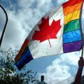 A Canadian flag with the pride rainbow integrated into it