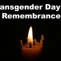 A candle lit in memory of trans folks who have been murdered