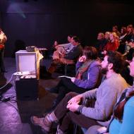 Photo: Council of Canadians board member Moira Peters and packed audience listen