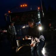 Drum dancer, Allyson Gear, stops a bus load of construction workers.