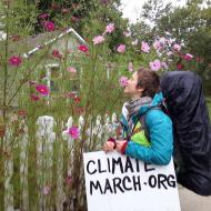 Sean smells the flowers on the Great Climate March