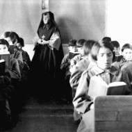 Photograph of students from Fort Albany Residential School reading in class