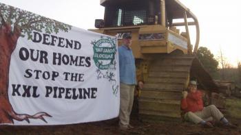 Defend Our Homes - Stop Keystone XL Pipeline  R.C and Doug locked to "skidder" -